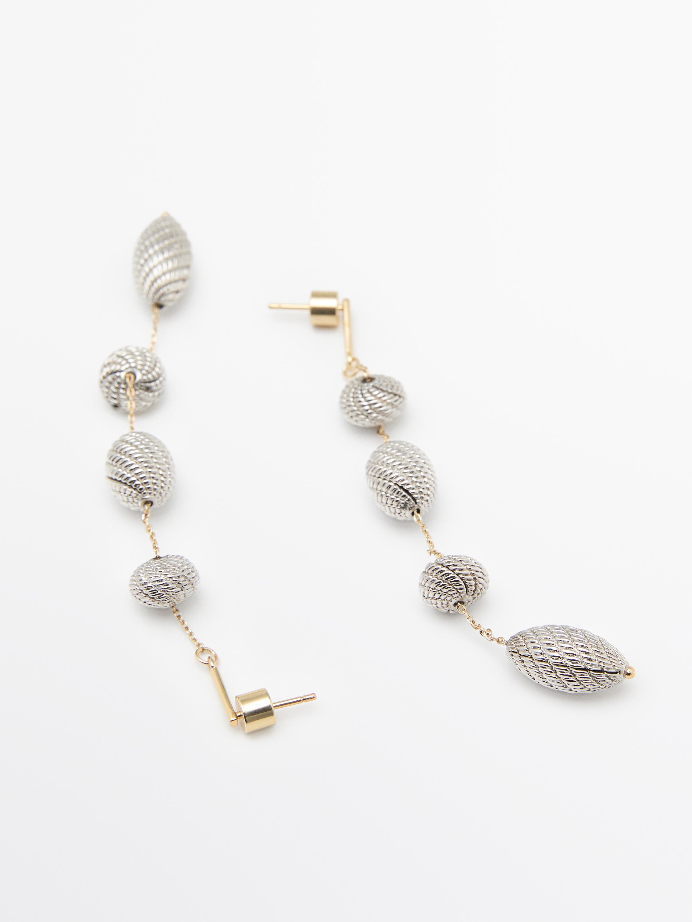 Boucles d’oreilles pendantes pièces texturées